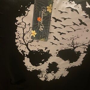 Black distressed skull hoodie.